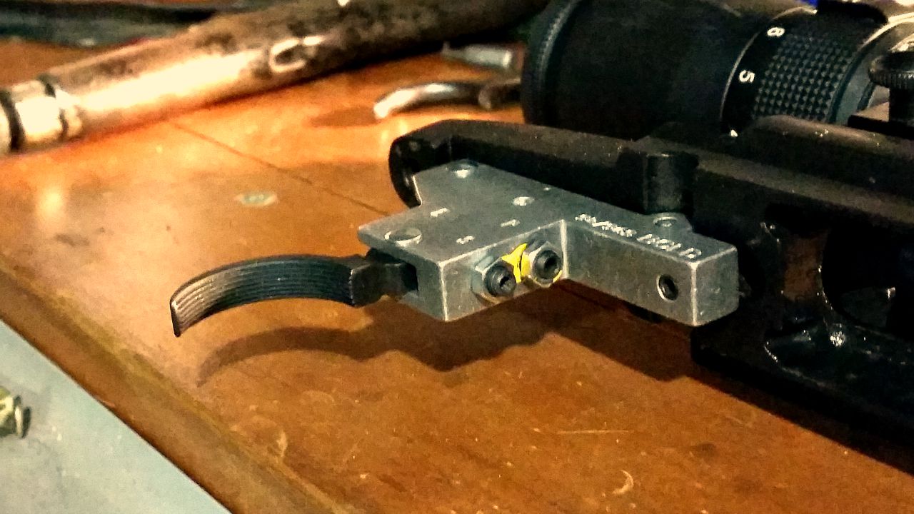 The yellow factory seal on the adjustment screws is broken.