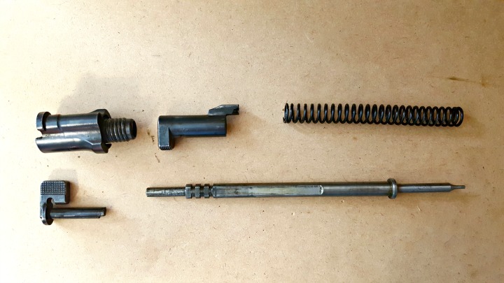 Shroud, cocking piece, spring, safety lever, and firing pin.